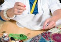 A woman sews a button Royalty Free Stock Photo