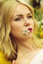 Woman or girl hold cherry flower in mouth, spring Royalty Free Stock Photo