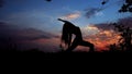 Woman shadow doing yoga, female silhouette in evening sky background. Royalty Free Stock Photo