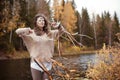 Woman Shaman at autumn lake