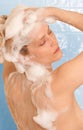 Woman shampooing hair Royalty Free Stock Photo