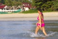 Woman shape beautiul relax on beach with pink bikini
