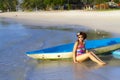 Woman shape bikini and canoe morning on beach