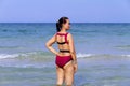 Woman shape with bikini red on beach