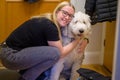 Woman hugs her loyal Old English Sheepdog