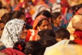 A woman in sharp focus covered her head with white and black scarf at a program on women empowerment at Allahabad. India