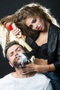 Woman shaving handsome bearded man Royalty Free Stock Photo