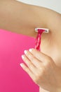 Woman shaving her armpit Royalty Free Stock Photo