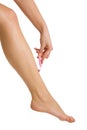 Woman shaving legs Royalty Free Stock Photo