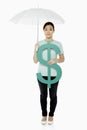 Woman shielding the dollar sign with an umbrella