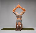 Woman in shirshasana headstand Royalty Free Stock Photo