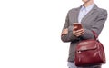 Woman in shirt and jacket is holding a mobile phone and a handbag business Royalty Free Stock Photo