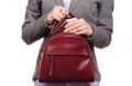 Woman in shirt and jacket put a mobile phone and purse in handbag business Royalty Free Stock Photo