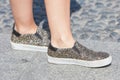 Woman with shoes with golden and silver shiny glitter before Stella Jean fashion show, Milan Fashion Week