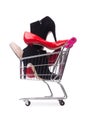 Woman shoes in shopping cart on white Royalty Free Stock Photo