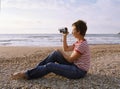 Woman shooting by camcorder Royalty Free Stock Photo