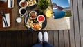 Woman shooting healthy breakfast on wooden table for mornings.