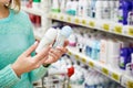 Woman in shop chooses deodorant Royalty Free Stock Photo