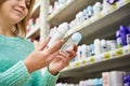 Woman in shop chooses deodorant