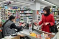 Yasny town, Russia - April 11, 2021 Woman shopper at the checkout of the store, editorial