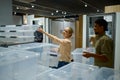 Woman shopper choosing plastic containers in store