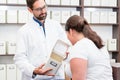 Woman shopping alternative drugs at herbalist Royalty Free Stock Photo