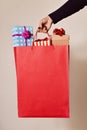 Woman with a shopping bag full of gifts Royalty Free Stock Photo