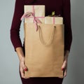 Woman with a shopping bag full of gifts Royalty Free Stock Photo