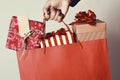 Woman with a shopping bag full of gifts Royalty Free Stock Photo