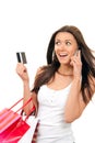 Woman shopping bags, credit card talking on phone Royalty Free Stock Photo