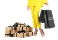Woman with shopping bags and gift boxes on white background, closeup. Black Friday Sale Royalty Free Stock Photo