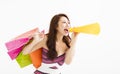 Woman with shopping bags and holding megaphone Royalty Free Stock Photo