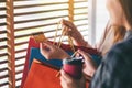 A woman with shopping bags holding and using a credit card Royalty Free Stock Photo