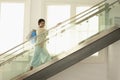 Woman With Shopping Bags On Modern Glass Stairs Royalty Free Stock Photo