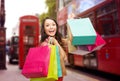 Woman with shopping bags over london city street Royalty Free Stock Photo