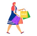 Woman with shopping bags during a sale. Shopper in dress carrying purchases, retail therapy concept. Enjoying discount