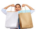 Woman, shopping bags and smile for store sale, discount or deal against white studio background. Happy isolated female Royalty Free Stock Photo