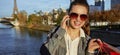 Woman with shopping bags talking on cell phone near Eiffel tower Royalty Free Stock Photo