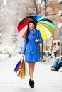 Woman with shopping bags and umbrella Royalty Free Stock Photo