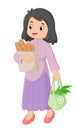 a woman shopping with baskets of vegetables and bags full of bread