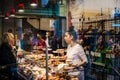 Woman shopping for bread bakery view from street