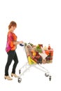 Woman with Shopping cart full dairy grocery Royalty Free Stock Photo