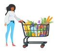 woman with shopping cart full of products Royalty Free Stock Photo