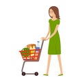 Woman and shopping cart with products. Health food. Supermarket trolley Royalty Free Stock Photo