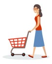 Woman and shopping cart. Supermarket trolley Royalty Free Stock Photo