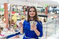 Woman on shopping with dollars and credit card . Royalty Free Stock Photo