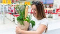 Woman shopping food grocery. Pregnant woman with healthy green vegetables, fresh tomato in market food bag on grocery Royalty Free Stock Photo