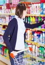 Woman shopping in grocery store Royalty Free Stock Photo