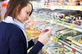 Woman shopping in grocery store Royalty Free Stock Photo