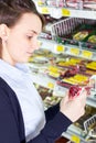 Woman shopping in grocery store Royalty Free Stock Photo